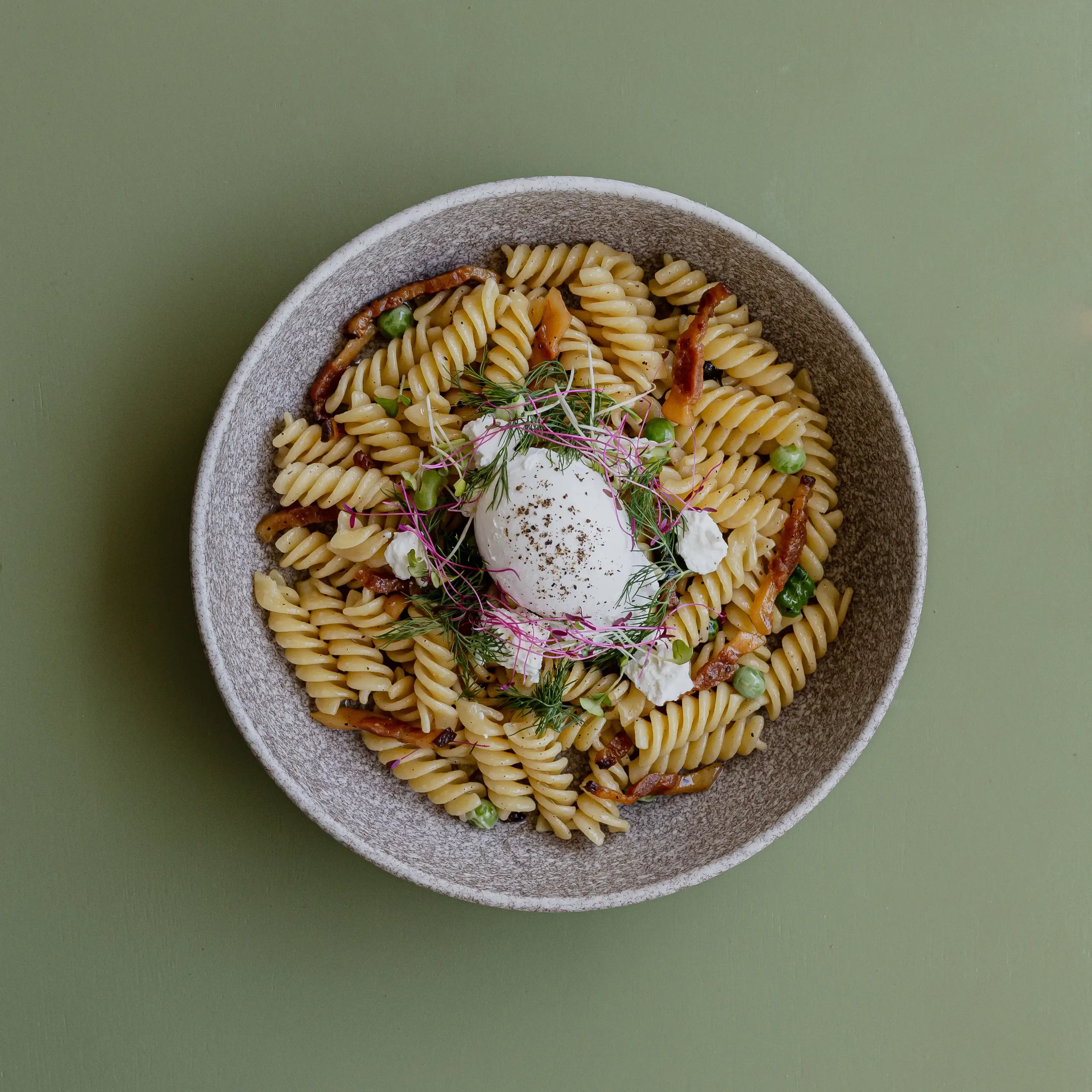 Breakfast pasta, guanciale, peas, mint, salted ricotta, poached egg